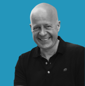 Foto of Thomas Wittig. Black and white. Background blue. Blog